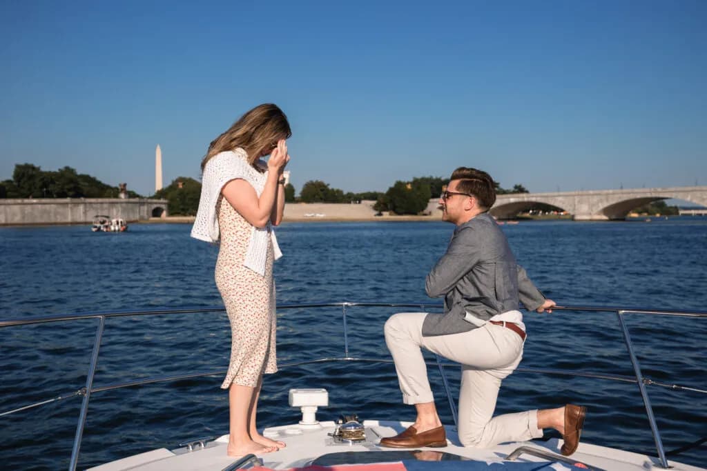 A couple aboard Geronimo on the Potomac River at dusk